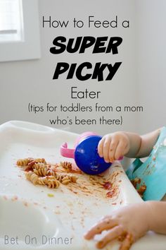 a toddler eating food with the words how to feed a super picky eater tips for toddlers from a mom who's been there