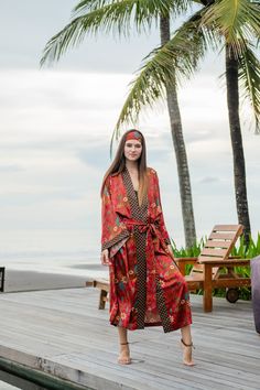 The perfect gift for anyone who loves the finer moments in life, this soft and sexy kimono robe is crafted by hand with strong attention to detail. With a gorgeous print and exclusive stitches, it's perfect for an extended variety of use. Elevate your kimono experience with the luxurious touch of our blended silk viscose fabric. This exquisite material harmoniously combines the elegance of silk with the comfort of viscose, resulting in a fabric that drapes effortlessly and exudes a subtle sheen. Bohemian Sleepwear With Kimono Sleeves For Spring, Bohemian V-neck Robe For Loungewear, Wrap Sleepwear For Vacation, Long Printed Robe For Loungewear, Festival Robe With Printed Kimono Sleeves, Bohemian Open Front Robe For Loungewear, Bohemian Long Sleeve Robe For Sleep, Bohemian Long Sleep Robe, Bohemian Open Front Loungewear Robe