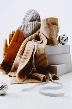 a pile of books and gloves sitting on top of each other