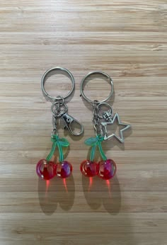 These iridescent cherry keychains are very cute and unique!  If you wanted to make them personalized you are able to add a letter of your choice whether it's for yourself or a friend- it makes the perfect gift.Each order comes with a gift Trendy Key Clip Keychain As Gift, Trendy Silver Keychains As Gift, Trendy Silver Keychains For Gifts, Trendy Silver Keychain For Gift, Trendy Keychain With Key Clip For Gift, Trendy Customized Keychains, Cute Green Keychains For Gifts, Cherry Accessories, Cherry Keychain