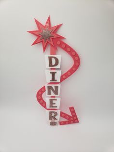 the word dinner spelled with letters and a star