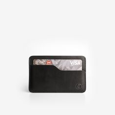 Make a statement with this impressive card holder in deep black leather. This is designed by artisans to create the best possible product with enduring quality. Easy to pick-up and take everywhere you go, this is a product meant for everyday enjoyment. A card holder offering honest character and pure satisfaction to make normal life a little easier. It has: A compact size Measures 10 cm x 6.5 cm x 0.5 cm Holds up to 7 cards in multiple pockets RFiD blocking to protect from scanning and card frau Minimalist Business Card Holder With Interior Slots, Minimalist Leather Card Holder With Rfid Blocking, Classic Everyday Card Holder With Rfid Blocking, Classic Rfid Blocking Card Holder For Everyday, Black Rfid Blocking Card Holder For Everyday Use, Classic Black Bifold Card Holder, Minimalist Leather Card Holder For Business, Minimalist Rfid Blocking Card Holder For Business, Minimalist Business Card Holder With Rfid Blocking