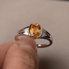 This is a gorgeous handmade creation. Its beauty is its simplicity & Elegance. The 6*8mm oval shape faceted natural citrine is crafted in solid sterling silver and with rhodium plated. All item is sent in a beautiful gift box If you have any idea of design your ring,pls contact me directly. You can realize more lovely stuff clicking the link https://www.etsy.com/shop/knightjewelry?refshopsection_shophome_leftnav Please leave the correct address and you phone number for delivering successfull Amber Birthstone Ring, Oval Citrine Birthstone Ring, Oval Yellow Citrine Birthstone Ring, Oval Citrine Birthstone Ring For Anniversary, Oval Amber Topaz Ring, Yellow Sapphire Oval Promise Ring, Oval Yellow Sapphire Promise Ring, Oval Topaz Promise Ring With Polished Finish, Oval Citrine Promise Ring