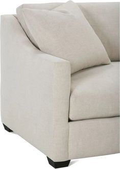 a white couch with two pillows on it's back and one arm facing the camera