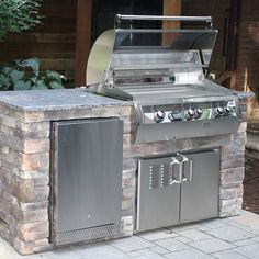 an outdoor bbq grill with two doors open