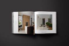 an open book showing the inside of a house with furniture and decor in it on a black background