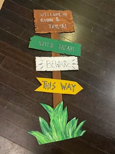 a wooden sign that has some signs on it