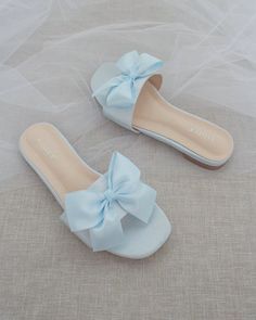 Classic slide flat sandals for casual and dressy look with added SATIN BOW. Simple and easy wear for brides, bridesmaids and wedding parties.DETAILS:COLORS AVAILABLE: Ivory, Light Blue, White, Pink, and ChampagneUPPER: Synthetic upper and liningMATERIALS: Mandmade outsole STYLE NAME: EVELYN Best Shoes For Women, Bridesmaid Sandals, Aesthetic Views, Pretty Sandals, Dr Shoes, Bridal Sandals, Fashion Slippers, Best Shoes, Slip On Sandals