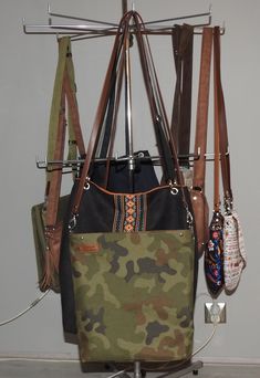 "UniQueBags handbags store offers: Military style crossbody bag, made of waterproof and durable strong tactical fabric. The interior is made of alcantara suedette, there are two slip pockets. The whole closes by strong metalzip. The strap of the bag is attached with carabiners, it is made of the highest quality Italian eco leather-this gives the bag a slightly more elegant look. The bag keeps its shape without filling, the bottom is additionally solidly stiffened. Dimensions of the bag: 34/35/8c Multifunctional Khaki Bag For Everyday Use, Outdoor Khaki Bag With Leather Handles, Khaki Crossbody Canvas Bag For Outdoor, Khaki Crossbody Bucket Bag For Everyday Use, Functional Khaki Shoulder Bag For Everyday Use, Khaki Leather Handles Crossbody Shoulder Bag, Outdoor Canvas Crossbody Bag With Leather Handles, Black Satchel With Leather Handles For Outdoor, Multifunctional Shoulder Bag With Adjustable Strap For Everyday