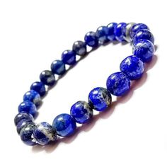 PRICES MAY VARY. [GENUINE LAPIS LAZULI 8mm] The natural beauty of lapis lazuli is truly captivating, reminiscent of a starry night sky embedded in stone. Its deep blue color exudes a sense of mystery and depth, while the golden veins and specks add a touch of celestial charm. [HEALING AND STRESS-RELIEF] This bead bracelet has powerful healing stones that can help reduce stress and anguish, promote relaxation and calm, and attract abundance, wealth, and trust. Ideal for business owners, men and women who manifest success. [ 7.5" (19cm) ELASTIC CORD] Designed to provide comfort and ease of wear, the LAPIS LAZULI bracelet features a durable elastic cord that effortlessly stretches to fit most wrist sizes. The flexible nature of the bracelet ensures a secure and comfortable fit, allowing you t Blue Tiger Eye Bracelet, Manifest Success, Lava Rock Bracelet, Blue Tiger Eye, Lava Stone Bracelet, Lapis Lazuli Bracelet, Attract Abundance, Blue Tiger, Lapis Lazuli Beads