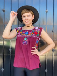 "Burgundy embroidered mexican shirt, fiesta outfit women, old spanish days, traditional puebla blouse, mexico blouse, latina floral blouse This adorable Puebla top is perfect for summer, the bright colors and hand embroidered flowers give just the taste of Mexico and summer combined. Rare to find It is definitely the Traditional Mexican top with a twist! Comes in Burgundy and multicolor floral embroidery Loose fit Measurements taken flat: --- SMALL --- Armpit to armpit 19\" Bottom hem width 21 1 Fitted Short Sleeve Blouse For Fiesta, Traditional Summer Blouse For Fiesta, Fiesta Tops With Floral Embroidery, Fitted Folk Style Top For Fiesta, Spring Fiesta Blouse, Fitted Traditional Tops For Fiesta, Fitted Traditional Top For Fiesta, Embroidered Blouse For Fiesta, Folk Style Fitted Blouse For Fiesta