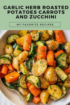 a white bowl filled with roasted potatoes and zucchini