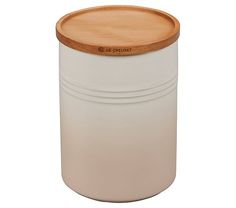 a white container with a wooden lid