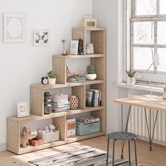 a room with a desk, bookshelf and various items on the shelves in it