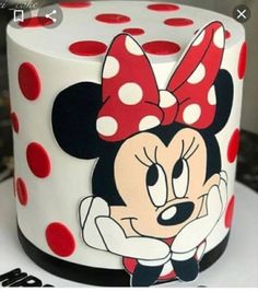 a minnie mouse cake with polka dots on it