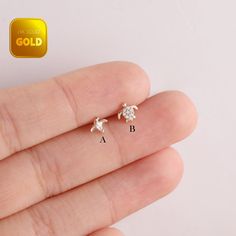 Metal: 14k solid gold, Available Gold color: Yellow gold  Guaranteed Authentic : 14k Solid Gold，Not Gold Plated or Gold Filled Thickness:0.82mm (20G)/ 1.0mm(18G)/ 1.2mm (16G) Stamp:14k Stone:cz stone ★Sold as single piece Welcome to our Adorable Ocean Collection! Let's discover these enchanting 14-carat yellow gold stud earrings that evoke baby turtles and little penguins. 🐢 Baby Sea Turtles: These gold stud earrings are inspired by baby sea turtles in the depths of the sea, who are always swimming in the azure waters, showing their flexibility and cuteness. The baby turtle-shaped stud earrings are delicate and lifelike, and through their small design, they present a fascinating natural beauty. 🐧 Little Penguins: Little penguins are the adorable epitome of the Arctic lands, and their rou Hypoallergenic Gold Cartilage Earrings As Gift, Hypoallergenic Gold Cartilage Earrings For Gift, Nickel-free Gold Cartilage Earrings Gift, Gold Sterling Silver Cartilage Earrings For Anniversary, Gold Cartilage Earrings For Anniversary, Tiny Gold Cartilage Earrings As Gift, Tiny Gold Cartilage Earrings Fine Jewelry, Tiny Gold Cartilage Earrings For Gift, Fine Jewelry Gold Earrings