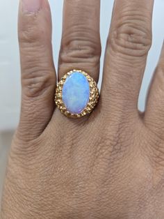 This vintage ring is a stunning piece of fine jewelry that will surely catch anyone's eye. Made of 14k solid gold, it features a beautiful jelly opal that adds a touch of elegance to its design. The ring is perfect for anyone who loves vintage jewelry or wants to add a unique piece to their collection. It is a great accessory that can be worn for any occasion and will surely complement any outfit. Don't miss the chance to own this gorgeous ring! The ring size is 5 3/4 The ring marked 14k inside. The total weight of the ring is 6.06 grams. The opal stone measures 1.45 ctw  Beautiful ring , pre owned and in good condition Jelly Opal, Gorgeous Ring, Opal Stone, Opal Ring, Beautiful Ring, Vintage Ring, Opal Rings, Rings Statement, Ring Gift