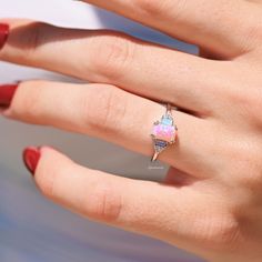 Pink Fire Opal & Opalescent Sapphire Ring - 925 Sterling Silver Minimalist Unique Engagement Ring for Women - Promise Ring - Gift for Her►Embrace the ethereal beauty of this Pink Fire Opal & Opalescent Sapphire Ring, crafted in 925 sterling silver. Featuring a stunning pink fire opal at its center, this ring exudes a soft, fiery glow that captivates with every movement. The opalescent sapphire accents add a touch of mystical charm, creating a harmonious blend of color and light.►Designed with a Pink Opal Sterling Silver Ring Gift, Pink Opal Ring In Sterling Silver For Gift, Opalescent Sapphire Ring, Opalescent Sapphire, Pink Fire, Mesmerizing Beauty, Engagement Ring For Women, Promise Ring Gift, Unique Engagement Ring