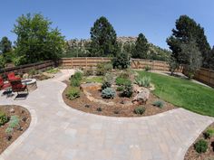 an outdoor patio area with seating and landscaping