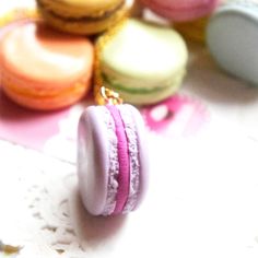 These adorable French Macaron charms are sculpted from polymer clay. Each measures approx. 1.5 inches in diameter and hangs on a gold tone chain that measures 24 inches in length . Macaron Cute, Clay Macaron, Macarons Paris, Macaron Coin Purse, Macaron Necklace, Parisian Jewelry, Le Macaron, French Macaron, French Macarons