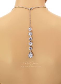 "Finish: Silver Platinum plated components Material: Top quality rhinestones, AAA Zirconia, lobster clasp. Length of Necklace: 17.5 inches and 5 3/4\" Zirconia backdrop. Length of Earrings: 1 1/4 inches from the top of the post. Quantity: Necklace + Earrings Weight: 10g + 35g Items Condition: 100% Brand New You can find this collection here: https://www.etsy.com/shop/PepeJewe?ref=listing-shop2-all-items-count&search_query=Perl You can find Zirconia jewelry here : https://www.etsy.com/shop/Pe Cubic Zirconia Jewelry With Handset Stones As Gift, Anniversary Jewelry With Handset Cubic Zirconia Stones, Adjustable Silver Cubic Zirconia Jewelry Sets, Hand Set Sterling Silver Drop Jewelry, Sterling Silver Hand Set Drop Jewelry, Teardrop Cubic Zirconia Jewelry With Adjustable Chain, Hand Set Silver Drop Jewelry, Gift Jewelry With Handset Crystal Stones, Silver Crystal Dangle Backdrop Necklace