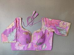 Buy stunning lilac embroidered saree blouse online in USA with lace. Elevate your Indian ethnic saree looks with beautiful readymade saree blouse, embroidered saree blouses, Banarasi saree blouse, designer sari blouses, sleeveless saree blouses from Pure Elegance Indian fashion store in USA.-front Purple Saree With Floral Embroidery, Fitted Lavender Blouse Piece For Festive Occasion, Festive Fitted Lavender Blouse Piece, Purple Semi-stitched Saree With Floral Embroidery, Purple Floral Embroidered Semi-stitched Saree, Festive Purple Saree With Floral Embroidery, Fitted Lavender Blouse Piece For Wedding, Fitted Lavender Blouse For Wedding, Fitted Lavender Wedding Blouse Piece