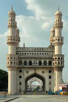 a large white building with two towers on each side