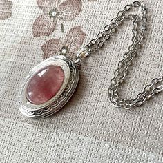 Opening Vintage Medallion in antique silver with oval cabochon of Strawberry Quartz can be used not only as an accessory, jewelry, but it is possible to insert a photo and keep a fond memory of your loved ones.  Both the locket and the chain are brass in silver - antique silver colour, the locket is decorated with ornaments. The chain is fastened with a carabiner. Packing and also small Jewelry Gift is included. oooooooo          ... UNIQUE JEWELRY FOR UNIQUE WOMAN ... oooooooo Details: oº Chain Vintage Locket Necklace, Pendant Necklace Vintage, Vintage Medallion, Accessory Jewelry, Oval Necklace, Mini Earrings, Vintage Lockets, Necklace For Her, Magical Jewelry