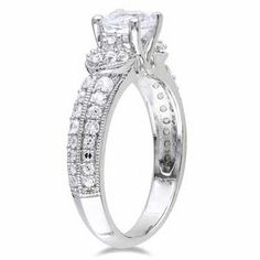 a white gold engagement ring set with diamonds