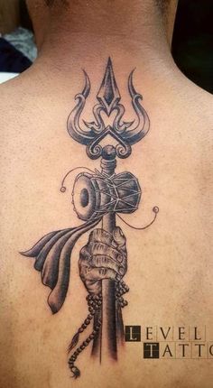 a man with a tattoo on his back