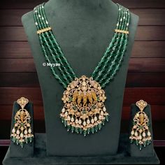 Sabyasachi inspired uncut polki & pearl ganesha necklace set/Emerald green rani haar/Premium dull gold plated temple jewelry/South indian   All orders Ship same day if placed before 4:00 PM EST  Necklace length: Adjustable length Create beautiful memory for any occasion with elegant jewelry for your loved ones We will be happy to navigate you through the process so if you have any questions regarding our product before placing an order reach out to us and we will be there to help you.  Thank you Emerald Temple Jewelry Bridal Necklace, Traditional Kundan Emerald Necklace For Festivals, Traditional Emerald Kundan Necklace For Festivals, Festive Bollywood Chandbali Emerald Necklace, Festive Emerald Kundan Necklace, Green Temple Jewelry Mala For Festive Occasions, Festive Bollywood Emerald Necklace, Festive Emerald Kundan Chandbali Necklace, Emerald Chandbali Necklace With Meenakari For Festivals