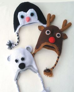 three crocheted hats with animals on them, one is brown and the other is white