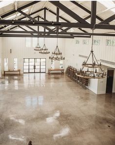 the inside of a building with several chandeliers hanging from it's ceiling