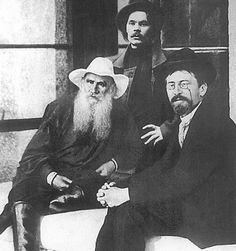 an old photo of three men with long beards