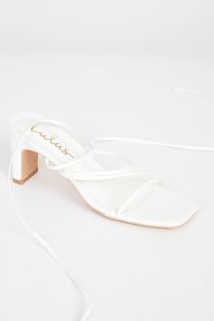 Get party-ready this season with the Lulus Aliah White Lace-Up High Heel Sandals! These cute and fun sandals feature a sleek faux leather composition that shapes a trendy, square toe upper and footbed with a strappy vamp atop a sturdy block heel. Long lace-up ties wrap around above the ankle to create a versatile look that pairs with anything in your closet! 2. 75" wrapped block heel. Cushioned insole. Rubber sole has nonskid markings. All Man Made Materials. Imported. Lulus | Aliah White Lace-U Fun Sandals, Nice Sandals, Got Party, Lace Up High Heels, Tie Wrap, Sandal Heels, Leather High Heels, Heel Sandal, Heel Sandals