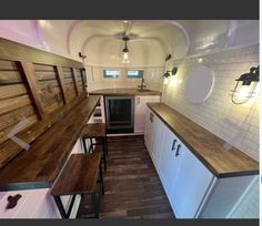 the kitchen is clean and ready to be used as a dining area in this tiny home