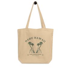 Cute, green Oahu Hawaii tote bag perfect for trips to the farmer's market this fall! If you are interested in a custom color or design then please reach out! Say goodbye to plastic, and bag your goodies in this organic cotton tote bag. There's more than enough room for groceries, books, and anything in between. 🤎 Product Details: * 100% certified organic cotton 3/1 twill * Fabric weight: 8 oz/yd² (272 g/m²) * Dimensions: 16″ × 14 ½″ × 5″ (40.6 cm × 35.6 cm × 12.7 cm) * Weight limit: 30 lbs (13.6 kg) * 1″ (2.5 cm) wide dual straps, 24.5″ (62.2 cm) length * Open main compartment * Blank product components sourced from Vietnam 🤎 Unique Designs: All designs are uniquely created and printed onto our apparel and accessories. Our designs are meant to inspire and comfort, so if you would like to Tropical Style Tote Bag For Daily Use, Tropical Rectangular Bags For Daily Use, Tropical Green Travel Bag, Eco-friendly Green Bags For Vacation, Eco-friendly Green Vacation Bags, Green Tropical Bags For Daily Use, Green Tropical Bags, Tropical Green Shoulder Bag For Travel, Rectangular Natural Tropical Bag