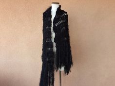 "I designed and hand knit this warm, black shoulder wrap shawl \"Maxi Scarf\" using a few of the very same yarns that I used when I made Stevie Nicks' black and silver Rhiannon shawl. Here is more info about Stevie's Rhiannon shawl and a chance to order one like it from me: https://www.etsy.com/listing/79939861/by-stevie-nicks-designer-clothing-gift This time, though, I started with two strands of thick, warm, sweater-like, colorfast black yarn. Then I accented the body of the piece with texture Black Bohemian Wraps One Size, One Size Black Bohemian Wrap, Black Bohemian Wraps For Winter, Bohemian Black Winter Wrap, Black One Size Bohemian Wrap, Bohemian Black Wrap One Size, Winter Bohemian Black Wrap, Black Knitted Shawl, Black Shawl Wrap For Winter