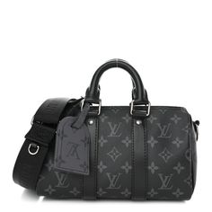 This is an authentic LOUIS VUITTON Reverse Monogram Eclipse Keepall Bandouliere 25. This chic shoulder bag is crafted of Louis Vuitton monogram canvas in black with gray on the sides. The bag features a black nylon shoulder strap with silver hardware. The top zipper opens to a black fabric interior with a pocket. Louis Vuitton Black Bag, Black Louis Vuitton Bag, Louis Vuitton Travel, Louis Vuitton Black, Louis Vuitton Keepall, Louis Vuitton Damier Ebene, Louis Vuitton Shoulder Bag, Vuitton Bag, Black Nylon