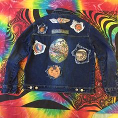 This Listing Is For A A Handcrafted One Of A Kind Denim Jacket That Has Handmade Patches. Handmade Patches Are New. But I Am Including 5 Free Vintage Pinbacks And 1 Free Go To Heaven Grateful Dead Cd. The Size Is M. Chest: (Armpit To Armpit) 23 Inches Sleeve: (Seam In Shoulder To End Of Sleeve) 26 Inches Length: (Seam On Collar To End Of Sweatshirt) Your Friends Will Wonder Where You Got Such A Fire Jacket. You Can Rock The Jacket While Listening To Grateful Dead Tunes. Blue Outerwear With Embroidered Patch For Fall, Fall Blue Outerwear With Embroidered Patch, Blue Winter Outerwear With Embroidered Patch, Blue Embroidered Winter Outerwear, Blue Long Sleeve Outerwear With Embroidered Patch, Blue Fall Outerwear With Patches, Blue Denim Jacket With Embroidered Patch For Fall, Blue Denim Jacket With Embroidered Patch For Winter, Winter Blue Denim Jacket With Embroidered Patch