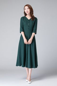 "Flare and swing, our Midi linen dress is fashioned with front button and fitted waist with pleating details,The summer linen dress is made from soft green linen fabric, with 3/4 length sleeves, midi length and two seam pockets. it is a linen front button dress with V neck ,women linen dress can show lady's beauty in any occasion. Details: * Green linen fabric * 50% linen , 50% cotton blend * Front button details * V neckline * Fitted waist * 3/4 length sleeves * Two seam pockets * Back zipper c Green Dress Summer, Linen Dress Short, Front Button Dress, Midi Linen Dress, Green Linen Dress, Mother Of Bride Outfits, Tailored Clothes, Linen Dress Women, Summer Linen Dresses