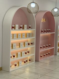 the shelves are filled with different types of teas and cups on display in front of them