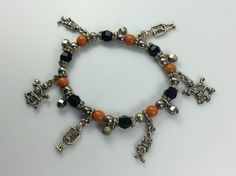 "Vintage 7\" Bracelet Stretchy Halloween Design With Silver Toned Skeletons Orange And Black Beads Used" Halloween Black Charm Bracelet, Gothic Adjustable Beaded Bracelets For Halloween, Adjustable Gothic Beaded Bracelets For Halloween, Handmade Black Charm Bracelet For Party, Black Beaded Bracelets For Party In Novelty Style, Black Beaded Bracelet For Halloween, Black Beaded Stretch Bracelet For Halloween, Beaded Charms, Halloween Beads