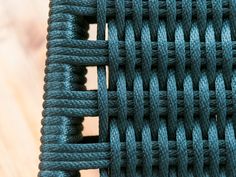 a close up view of a blue woven material