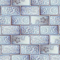 a blue and white tile wallpaper pattern