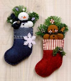 two christmas stockings with teddy bears in them