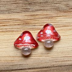 Tiny clip on earrings. Little plastic mushrooms  1/2 cm across. Invisible (clear plastic) clip on closures.  Lightweight.  Earrings are not intended to be worn while sleeping bathing or swimming. Not recommended for children under three. See more: https://www.etsy.com/ca/shop/CleverLittleEars CANADIAN PRICES INCLUDE GST/HST WHERE APPLICABLE. ETSY WILL CALCULATE ANY PST OWING AT CHECKOUT. While the cost of shipping makes returns or exchanges impractical, please do contact me with any concerns abo Adjustable Mushroom Design Earrings As Gift, Cute Mushroom Earrings, Mushroom Clip On Earrings, Nickel-free Mushroom Shaped Earrings As Gift, Muahroom Earrings, Plastic Clips, Clip On Earrings, Etsy Earrings, Stuffed Mushrooms