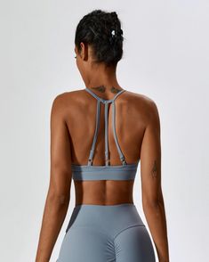 Haze Blue Strappy Sports Bra With Built-in Bra, T-back Sports Bra With Straps For Workout, Strappy Back Sports Bra For Yoga, Sports Bra With Strappy Back And Built-in Bra, Sportswear Strappy Back Sports Bra For Yoga, Racerback Sports Bra For Pilates, Sporty Racerback Sports Bra With Straps, Adjustable Straps T-back Sports Bra For Yoga, Athleisure Sports Bra With Adjustable Straps For Yoga