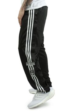 ADIDAS Black sport pants for men. Originally created for warming up on the pitch, the adidas adibreak pants have become a symbol of freedom of expression. Unbutton them at the ankles, up to the knees, or keep all the buttons closed, you decide how to wear them. The model wears a size L and is 187cm tall. Medium temperature washing and ironing is recommended. Autumn winter season. ATHLETES WORE THEM FIRST. NOW IT'S YOUR TURN. ORIGINALLY MADE FOR WARMING UP ON THE PITCH, THE ADIDAS ADIBREAK TRACK Adidas Pants Outfit Men, Adidas Track Pants Outfit Men, Adibreak Track Pants, Adidas Track Pants Outfit, Adidas Pants Outfit, Adidas Adibreak, Adidas Outfit Men, Adidas Trousers, Track Pants Outfit