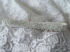 Introducing our Bespoke and Elegant Wedding Garter Adjourned with Small White Beads.    This bead adjourned garter is all about comfort and style. Crafted from stretchy elastic, it's designed to fit you perfectly, ensuring you're at ease as you dance the night away.  Crafted with love and attention to detail, this garter is more than an accessory - it's a cherished keepsake that captures the essence of your special day.  Why Choose Our Pearl Wedding Garter:  🌸 Uniquely Bespoke: Exclusive design you won't find anywhere else. Your garter will be as special as your love story.  🌸 Perfect Bridal Gift: Searching for the ideal bridal gift? Look no further. Our beaded garter is a heartfelt gift that will be treasured for years to come.  🎁 Each garter comes beautifully wrapped in a gift box.  M Adjustable Pearl Bridal Accessories For Wedding, Fitted Beaded Bridal Belt For Wedding, Adjustable Beaded Bridal Accessories For Wedding, Beaded Bridal Accessories For Wedding, Beaded Pearl Bridal Accessories For Wedding, Adjustable Beaded Bridal Belt For Wedding, Adjustable Embellished Bridal Belt For Wedding, Adjustable Beaded White Bridal Accessories, White Beaded Adjustable Bridal Accessories